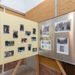 movable wall with photographs of various bears and architectural drawings