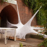 A web sculpture made out of fine threads in the garden of Bärenzwinger. It resembles a spider's web